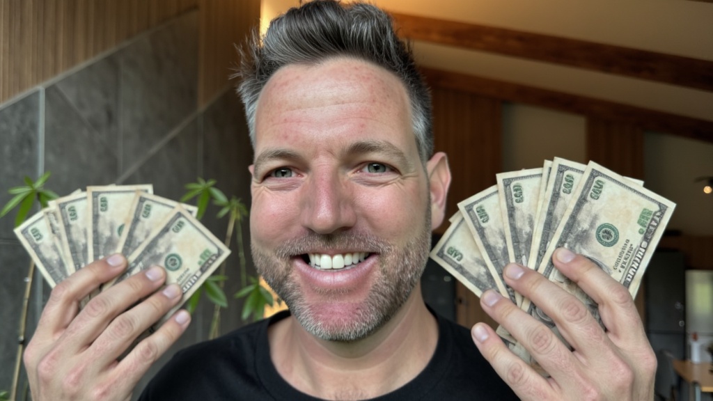Generated thumbnail: Nick holding two fans of cash